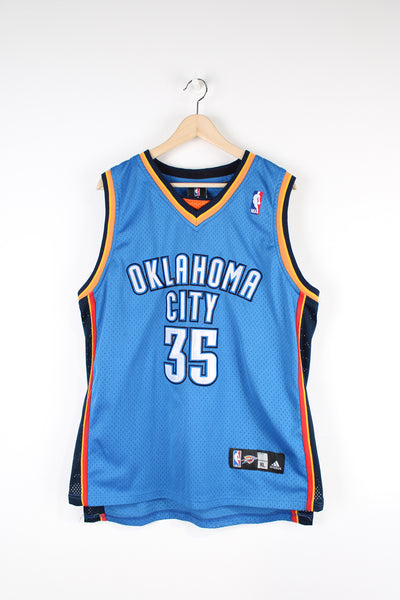 Oklahoma City Thunder number 35 Kevin Durant. Made by Adidas, Features applique letters/ numbers.  good condition   Size in Label:  Mens XL - Measures like a L