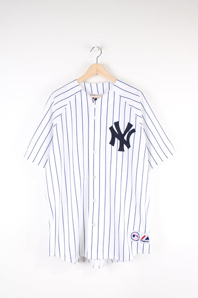 New York Yankees baseball jersey by Majestic with applique logo on the front. White shirt with navy blue pinstripe.   good condition  Size in Label:  Mens XL 