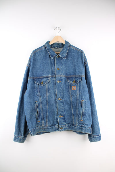 Vintage Carhartt trucker style denim jacket with embroidered Carhartt logo patch