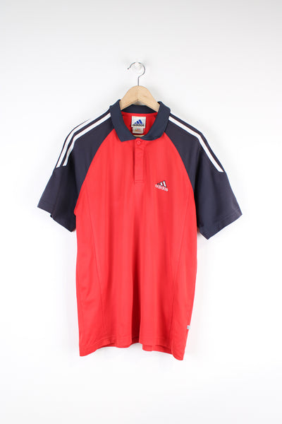 Vintage Adidas Polo Shirt in a red and navy colourway, has the iconic 3 white stripes going down the sleeves, button up with embroidered logo on the chest. 