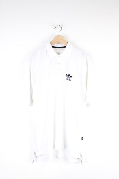 Vintage Adidas Polo Shirt, plain white colourway with black embroidered logo on the chest, button up with short sleeves. 