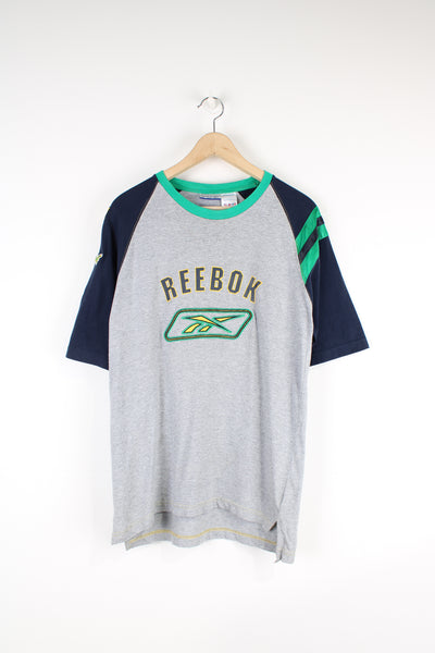 Vintage Reebok T-shirt, grey, blue and green colourway, crewneck, short sleeved and has embroidered logos on the front and sleeve 