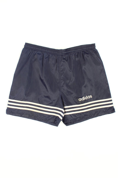 Vintage 90's Adidas navy blue satin sport shorts with white three stripe details on the leg