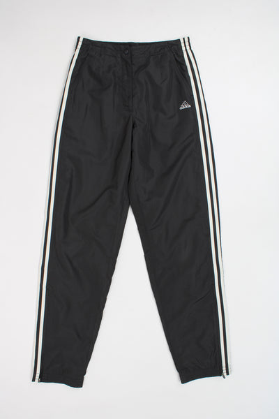 Adidas black three stripe tracksuit bottoms with popper fastening, draw string waist and embroidered logo on the pocket