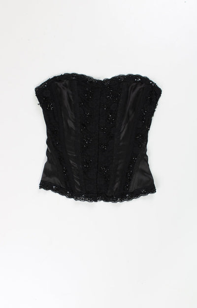 Black Y2K Jane Norman corset top. Made from a slightly stretchy black satin style fabric with lace and sequin embellishment. Closes with hook and eye fastenings down the front and also ties at the back to adjust the fit. good condition  Size in Label:  No Size Label - Measure like XS