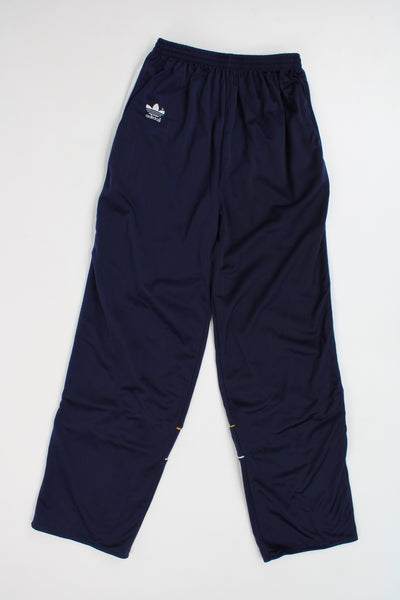 Adidas navy blue three stripe tracksuit bottoms with elasticated waist and embroidered logo on the pocket and leg