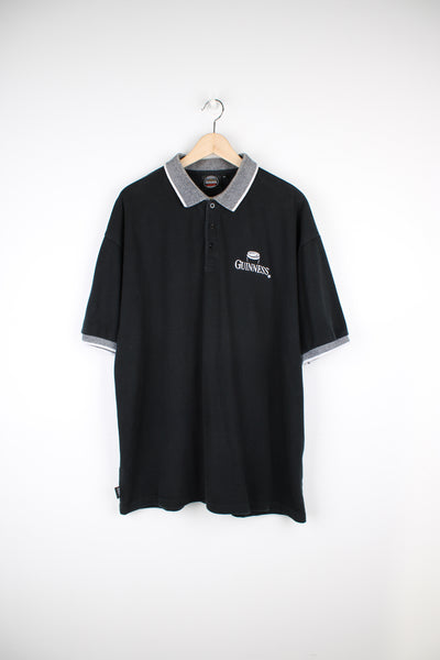 Guinness merchandise all black polo shirt with embroidered logo on the chest 