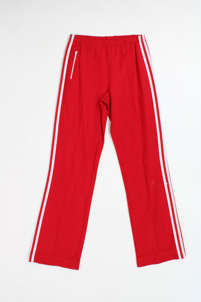 Vintage 80's Adidas german red tracksuit bottoms with elasticated waistband, signature three stripes 