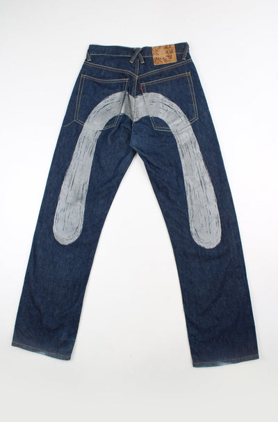 Evisu Jeans dark wash jeans, with grey printed 'm' motif on the back of the legs 
