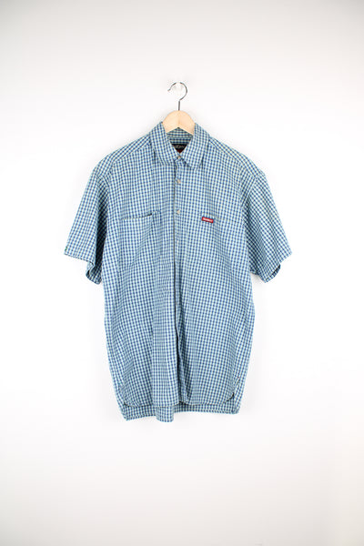 Kickers two tone blue plaid, button up cotton shirt. Features embroidered logo on the chest 