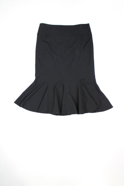 Vintage Y2K black knee length skirt. detail at the front. Could be worn mid or low rise depending on measurements. Features paneling that is cut on the bias to create ruffles at the hem.   good condition  Size in label:   40 - Measures as a Womens size 10 (S) when worn low rise.