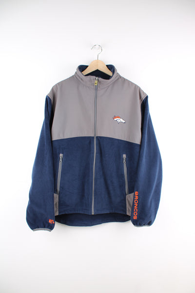 Denver Broncos navy blue and grey zip through fleece features embroidered logo on the chest and zip up pockets 