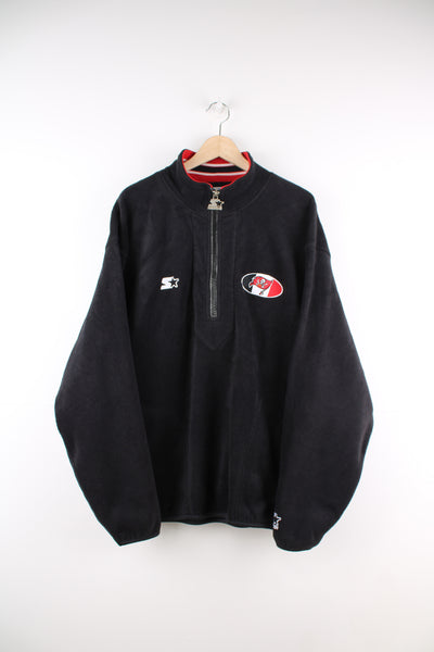 Tampa Bay Buccaneers all black 1/4 zip fleece by Starter, features embroidered logo on the chest and back of the collar