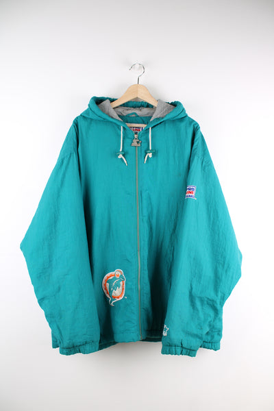Vintage  Miami Dolphins NFL Pro Line jacket by Starter in the signature turquoise colour way features embroidered patch on the hem and back 