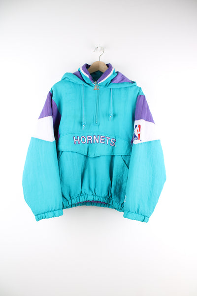 Vintage 90's Starter Charlotte Hornet NBA 1/4 zip jacket in the team colour way with kangaroo pocket, embroidered logo on the front and Hornets spell-out on the back. 