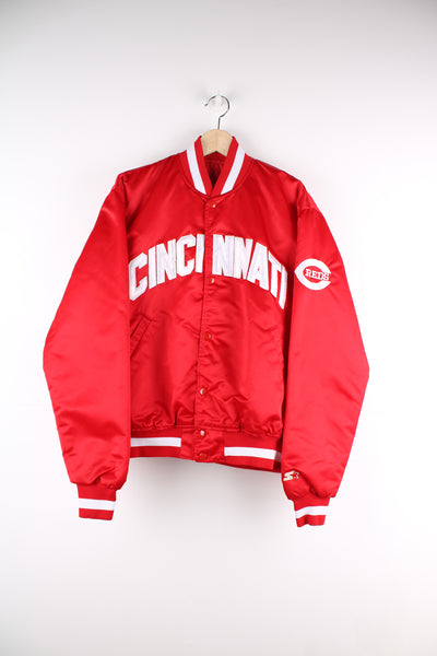 Vintage 90's Starter MLB Cincinnati Reds varsity jacket. Red satin jacket with applique "Cincinnati" on the chest and logo on the arm. good condition - small mark on cuff Size in Label: Mens L