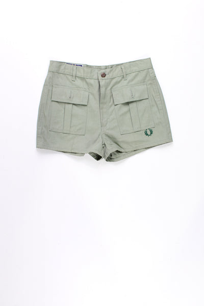 Vintage khaki green Fred Perry high waisted women's tennis shorts features embroidered logo near the hem