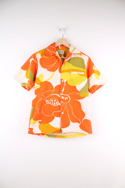 Vintage 60's Hawaiian Shirt in a orange, white and yellow colourway, floral pattern design printed all over, button up with a camp collar and has a chest pocket.
