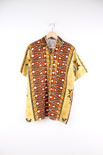 Vintage 70's Hawaiian Shirt in a orange, white and yellow colourway, patterned design printed all over, button up with a camp collar and has a chest pocket.