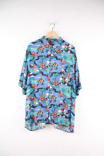 Vintage 90's Reyn Spooner, Mickey Mouse Disney Hawaiian Shirt in a blue colourway, cartoon print all over, button up and has a chest pocket.