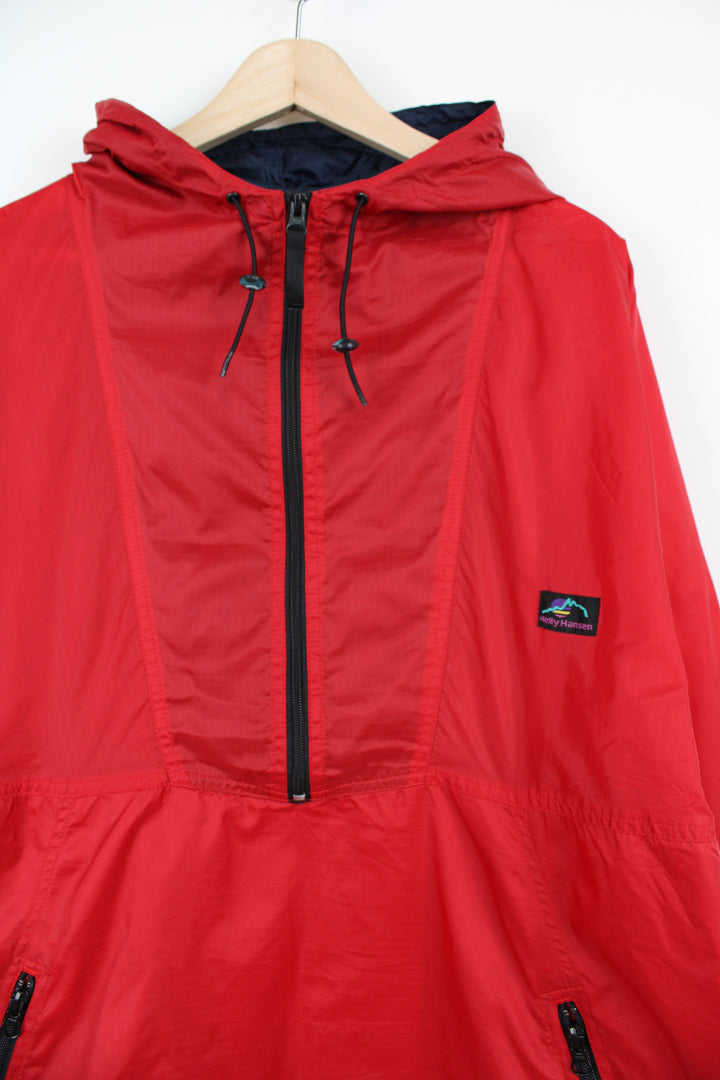 Helly Hansen red 1/4 zip windbreaker jacket with embroidered logo on the chest