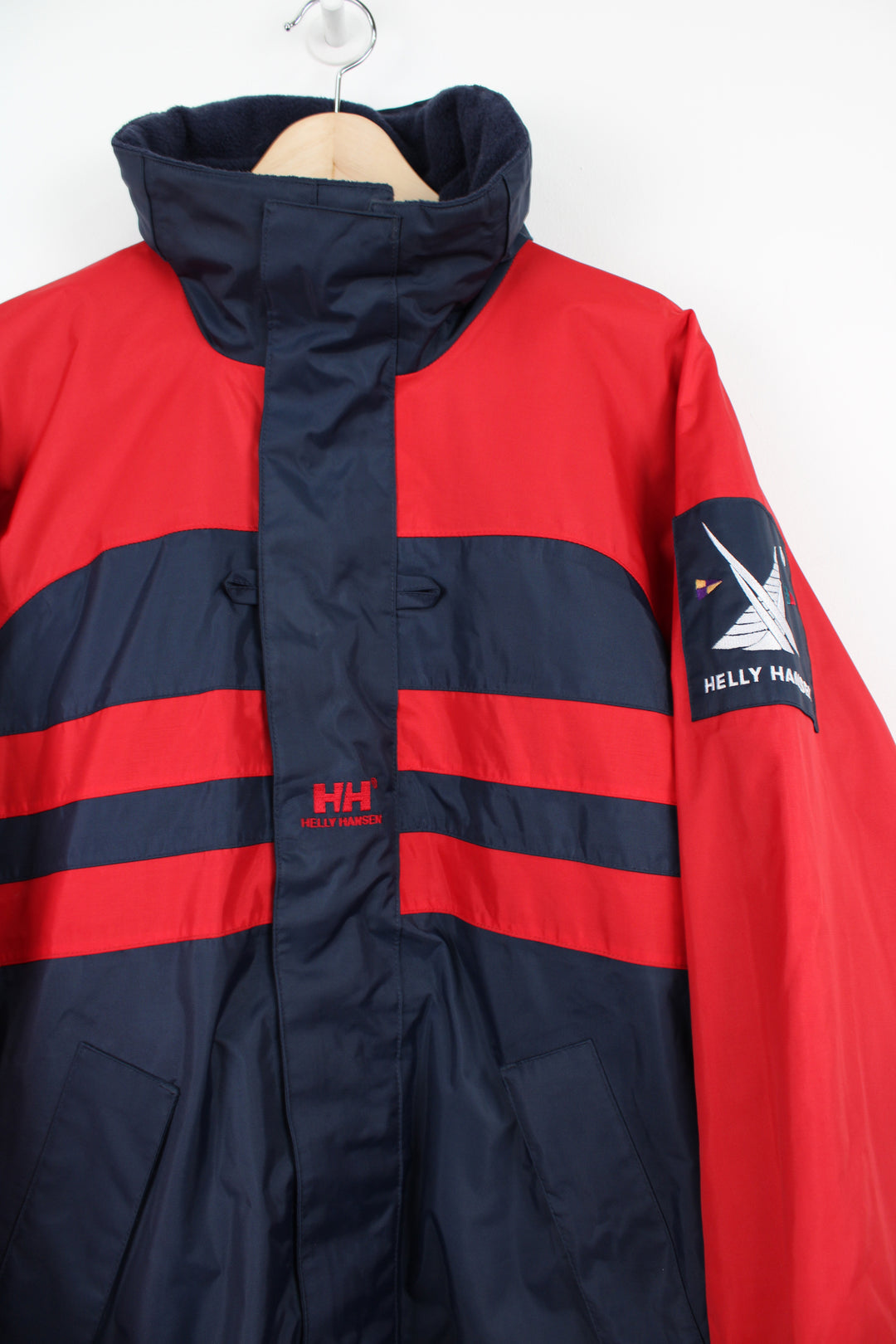 Vintage red and blue Helly Hansen Sailing waterproof jacket with embroidered logo on the chest and foldaway hood