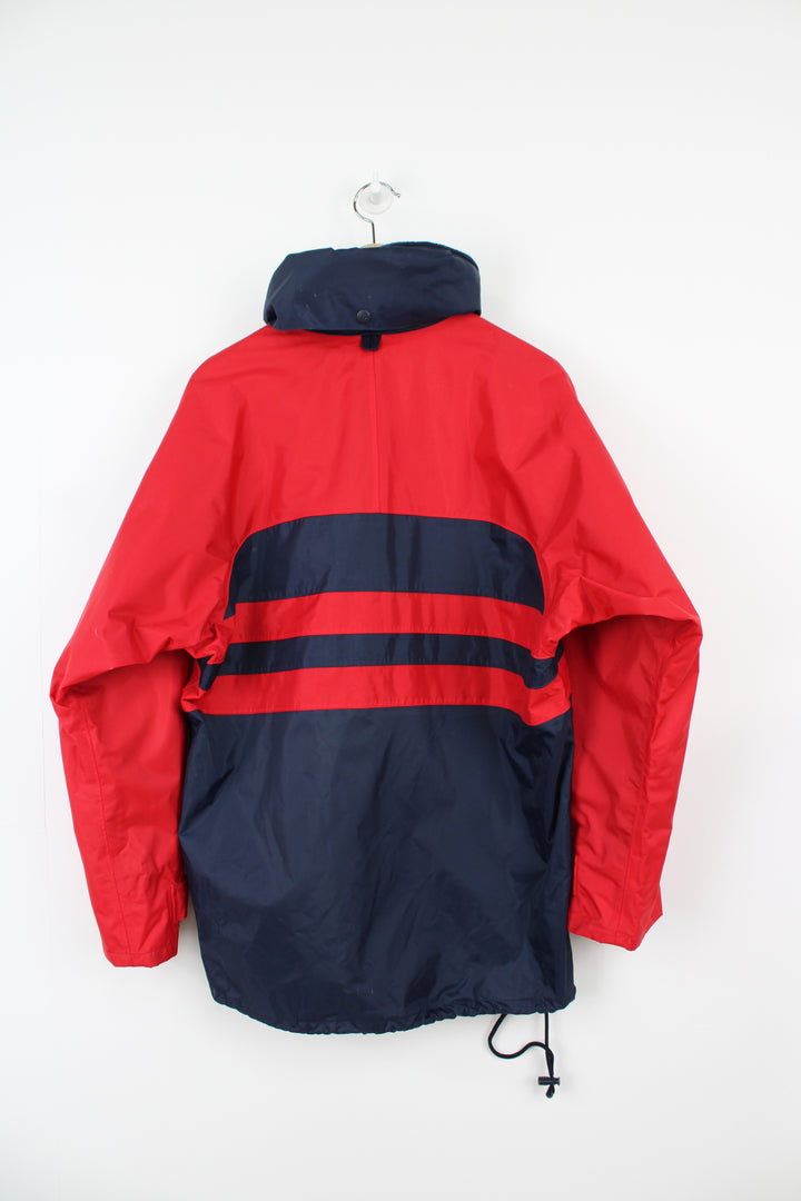 Vintage red and blue Helly Hansen Sailing waterproof jacket with embroidered logo on the chest and foldaway hood