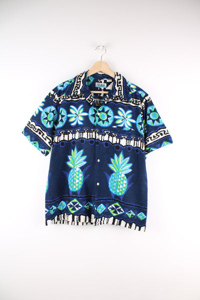 Vintage 70's Penny's Hawaiian Shirt in a blue colourway, tribal style print all over, button up with a camp collar and has a chest pocket.