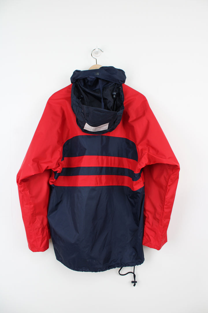 Vintage red and blue Helly Hansen Sailing waterproof jacket with embroidered logo on the chest and foldaway hood