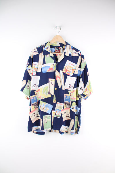 Quiksilver Hawaiian Shirt in a blue colourway, surf board and postcard style print all over, button up with camp collar and has a chest pocket.