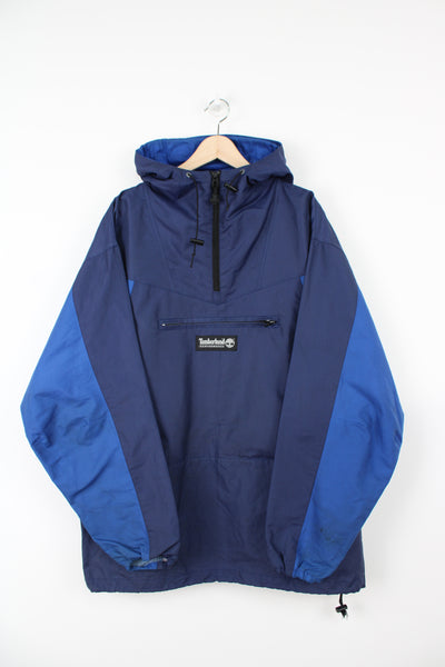 Timberland blue 1/4 zip lightweight windbreaker jacket with hood and embroidered logo on the front