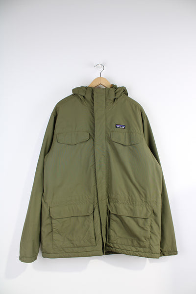 Patagonia Parka Jacket in a green colourway with a brown fleece lining, zip up, multiple pockets, hooded and has the logo embroidered on the front. 