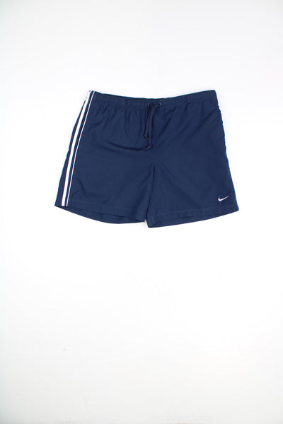 Nike Shorts in a blue colourway, adjustable waist, pockets, and has the swoosh logo embroidered on the front.