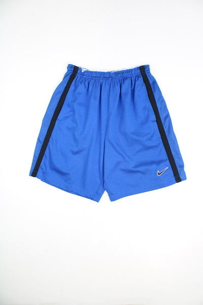 Nike Shorts in a blue and black colourway, adjustable waist, pockets, 65% cotton 35% polyester, and has the swoosh logo embroidered on the front.