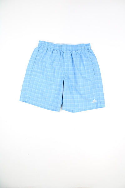 Adidas Plaid Shorts in a blue and white colourway, adjustable waist, pockets, and has the logo embroidered on the front.