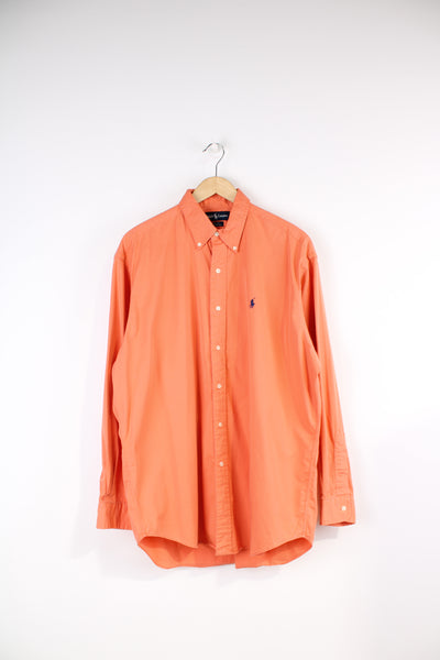Vintage Ralph Lauren Shirt in a plain orange colourway, oversized, button up shirt with the logo embroidered on the chest. 