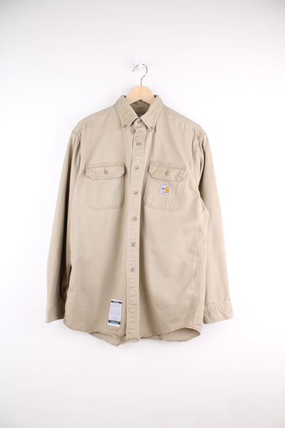 Carhartt heavy duty cotton button up shirt with branded chest pocket in tan 