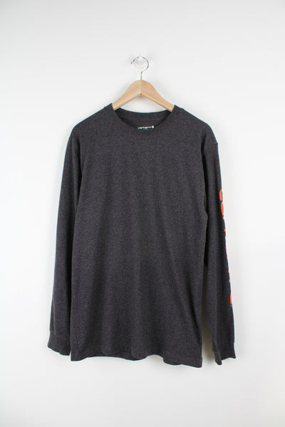 Dark grey Carhartt loose fit, long sleeve t-shirt with spell-out branding down the sleeve 