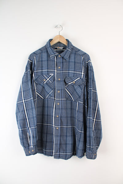 Navy blue plaid Carhartt button up shirt, has small embroidered logo on chest pocket