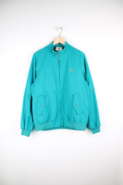 Vintage 90s turquoise Lacoste harrington jacket with embroidered logo on the chest. Features   good condition  Size in Label  Mens M -  Measures more like a S