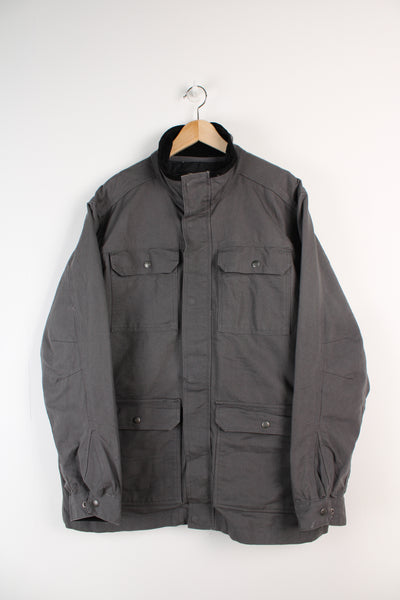 Grey Carhartt workwear jacket with corduroy collar, multiple pockets and removable quilted liner