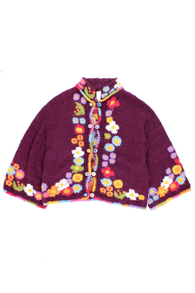 Vintage Amano chunky knit cardigan with floral design and bell sleeves. Made in Bolivia from 50% wool 50% Alpaca. Closes with decorative ceramic buttons. good condition - some light bobbling</p> Size in Label: Womens S/M - Measures more like a M/L