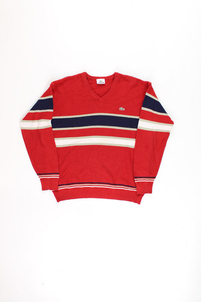 Vintage Lacoste red crew neck knit jumper with embroidered crocodile logo on the chest and horizontal stripe pattern across the chest/ arms.