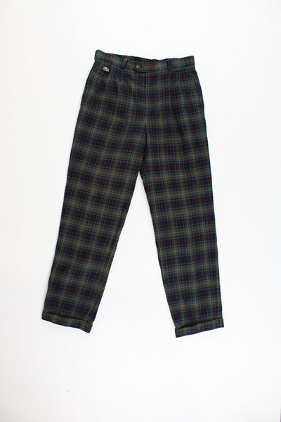 Lacoste plaid trousers in a green, blue, red and yellow colourway, multiple pockets, cuffed at the bottom and has the logo embroidered on the front.