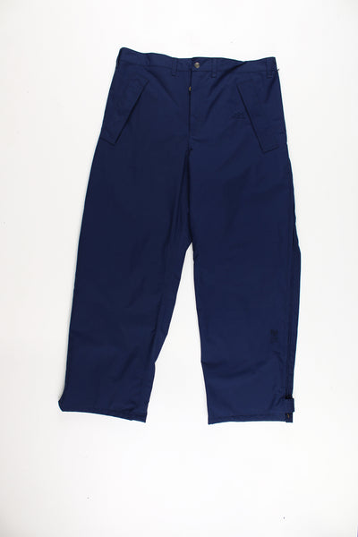 Helly Hansen Walking Trousers in a blue colourway, zip down the side of the legs and has the logo embroidered on the front.