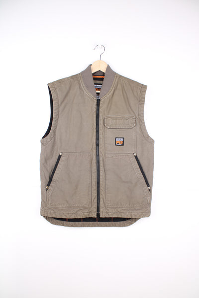 Timberland Pro Series Gilet in a brown colourway, workwear style, zip up, multiple pockets, and has the logo embroidered on the front and back.