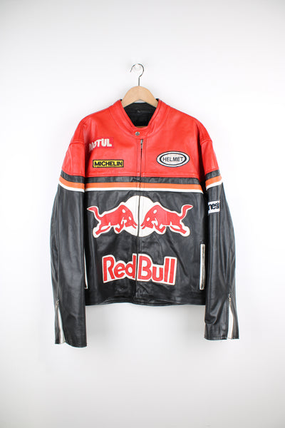 Vintage Red Bull Racing black and red leather jacket with embroidered badges and sponsors  Fair condition - The surface of the white leather sections are peeling away (leaving behind grey suede). Scratches on the back of the jacket in the red section and discolouration to the patches on the front (see photos)  Size in Label: Mens XXXL - Measures more like an XXL