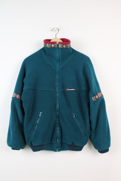 Vintage Made in England Berghaus 'Levanter XCT' teal blue zip through wind stopper fleece with pockets and embroidered logo on the chest