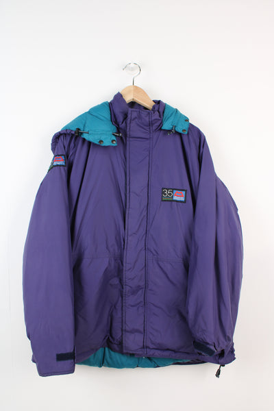 Mountain Equipment Made in the UK purple puffer jacket with and logo on front and removable hoodMountain Equipment Made in the UK purple puffer jacket with and logo on front and removable hoodc