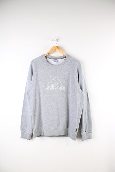 Adidas grey crew neck sweatshirt features large embroidered logo on the chest